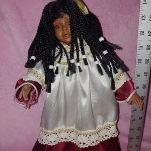 Porcelain African American doll. Musical.